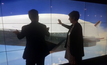 Dignitaries learn more about joint UQ-Boeing initiatives via a massive digital touch screen